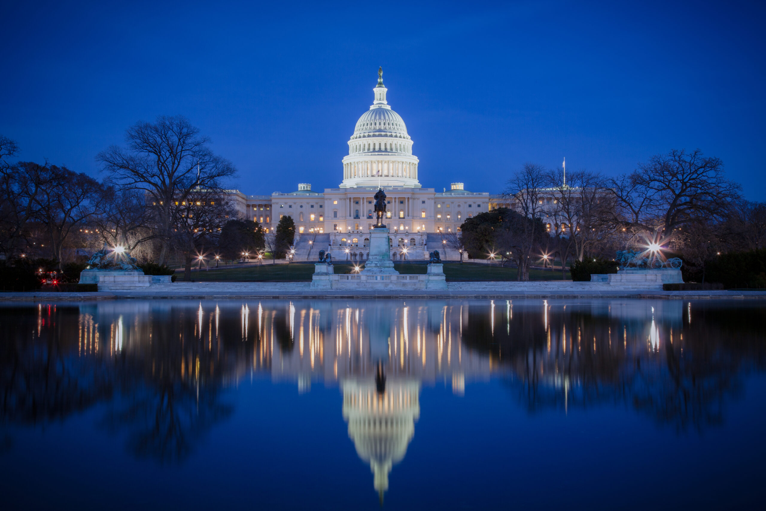 U.S. Capitol at night, with reflection on ice